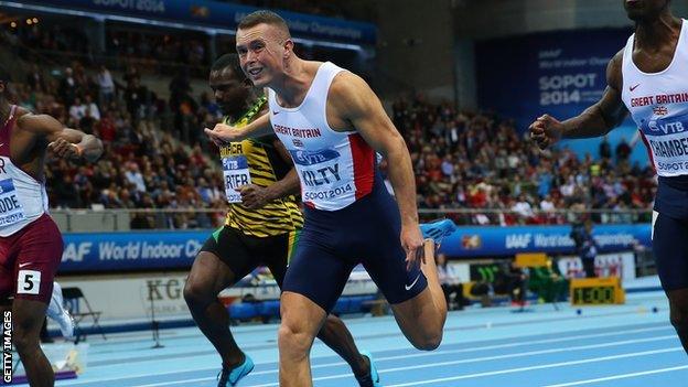 Richard Kilty crosses the line to become World Indoor Champion