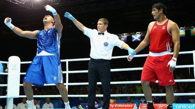 Ross Henderson celebrates beating Parveen Parveen Kumar of India