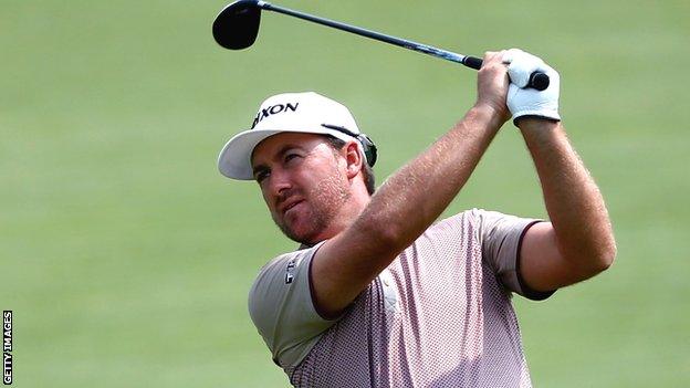 Graeme McDowell watches his second shot at the sixth hole in the second round