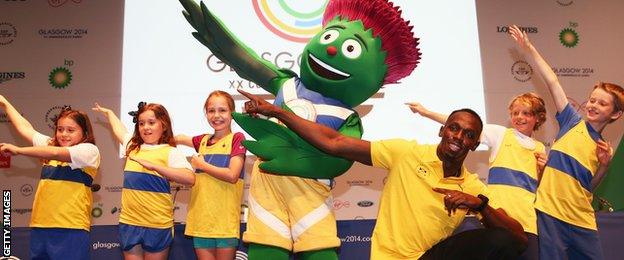 Bolt poses with Glasgow 2014 mascot Clyde