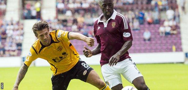 Hearts' Morgaro Gomis is challenged by Martin Mcniff of Annan