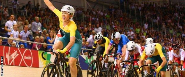 Annette Edmondson of Australia celebrates as she crosses the line to win gold in the Women's 10km Scratch