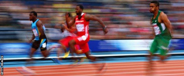 Warren Fraser of Bahamas, Richard Thompson of Trinidad and Tobago and Mark Jelks of Nigeria compete in the Men's 100m