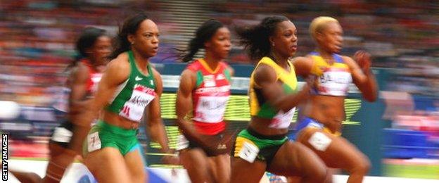 Veronica Campbell-Brown of Jamaica (second from left) wins her heat in the women's 100 metres