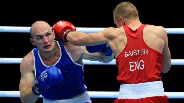 Northern Ireland heavyweight Steven Ward attempts to avoid a left hand from England's Warren Baister in Sunday's bout