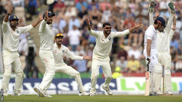 India appeal for the wicket of England's Alastair Cook