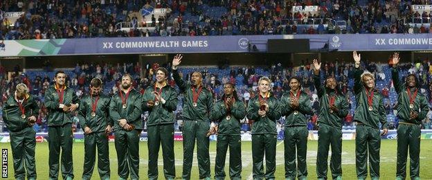 South Africa's triumphant players wave to the crowd after winning gold