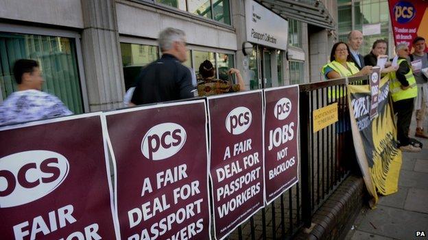 Striking wrkers outside the HM Passport office in Victoria, central London, on 28 July 2014