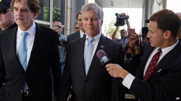 Former Virginia Governor Robert F. McDonnell, centre, with his attorney Henry W Asbill, left, arrive at the federal courthouse in Richmond, Virginia, 28 July 2014