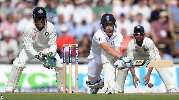 England's Jos Buttler reverse-sweeps