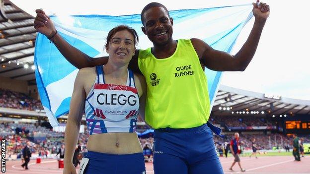 Gold medalists Libby Clegg of Scotland and her guide Mikail Huggins