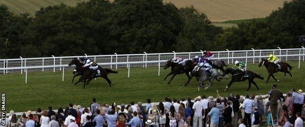 Van Percy (number nine) winning the Summer Stakes at Glorious Goodwood