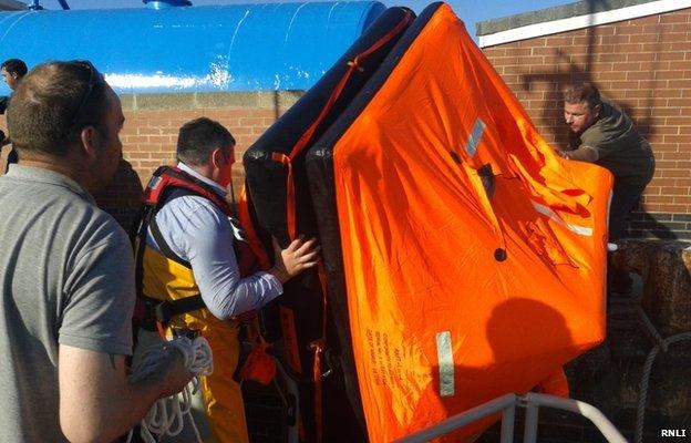 Life-raft being brought ashore at Hartlepool Fish Quay