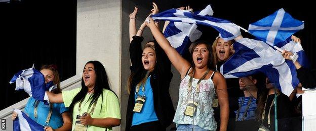 Scotland fans cheer on the country's men's gymnastics team