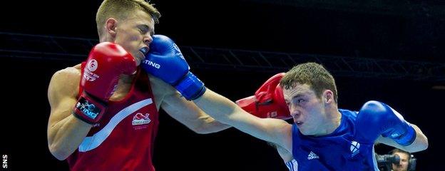 Scotland's Reece McFadden lands a jab on English fighter Charlie Edwards