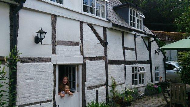 Rebecca Fletcher and her daughter at their new home in Hampshire