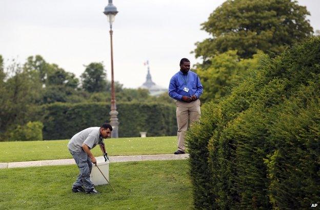 Pest-controllers in the Louvre gardens, Paris 29 July