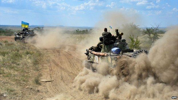 Ukrainian soldiers advancing through the countryside in Donetsk region - 30 July 2014