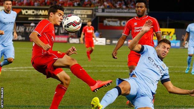 Matija Nastasic of Manchester City (right) and Philippe Coutinho of Liverpool vie for the ball during the International Champions Cup tie at Yankee Stadium