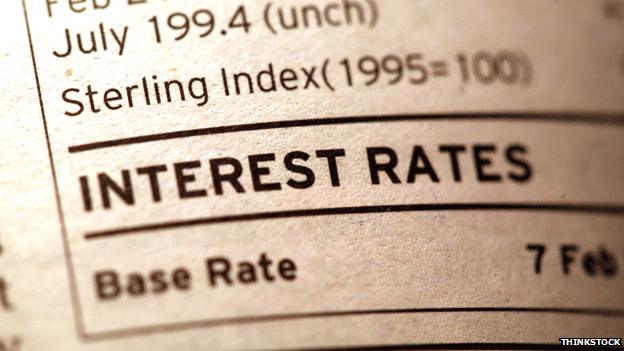 Paper with interest rate sign on it