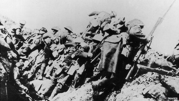 British troops climbing from their trench on the first day of 'The Big Push' on the Somme during World War One