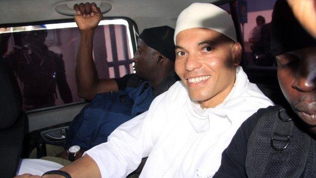 Karim Wade arrives in court in Dakar, Senegal, on 31 July 2014