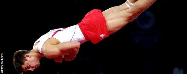 England's Max Whitlock flies through the air during his floor routine