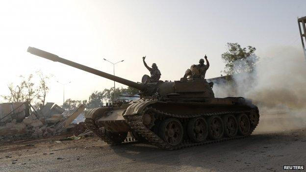 Fighters from the Benghazi Shura Council on top of a tank in Benghazi