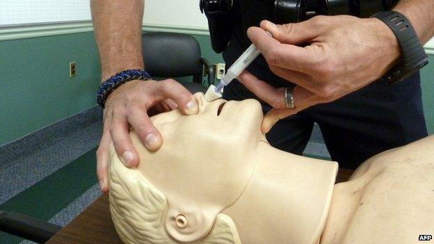 Supervisor Sergeant Casey Stidham, is shown demonstrating the use of naloxone at the Anne Arundel County Police Department in Millersville , Maryland 17 June 2014
