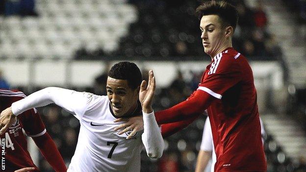 Wales' Tom Lawrence (R) challenges England's Tom Ince during during an Under-21 European Championship qualifier at Pride Park