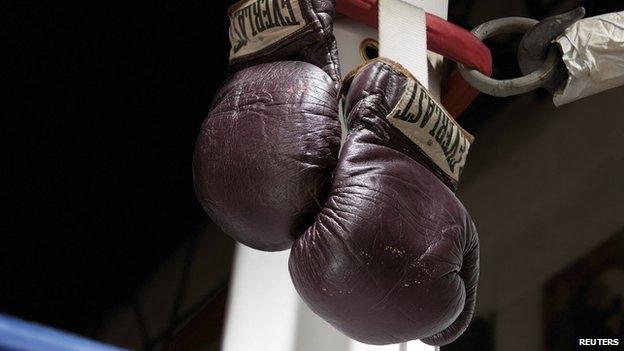 The 1971 Muhammad Ali gloves from his first Joe Frazier bout are pictured in this undated handout photo courtesy of Heritage Auctions received July 31, 2014