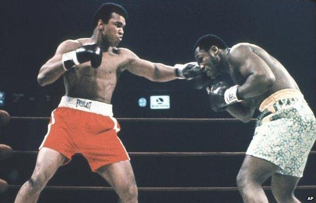 Muhammad Ali and Joe Frazier competing at the World Heavyweight Championship in 1971