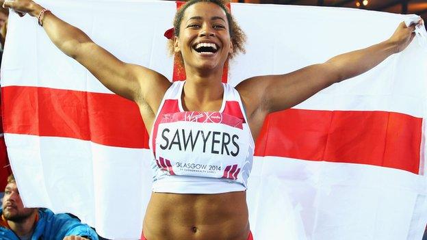 Jazmin Sawyers with England flag after winning silver in the long jump at the 2014 Commonwealth Games