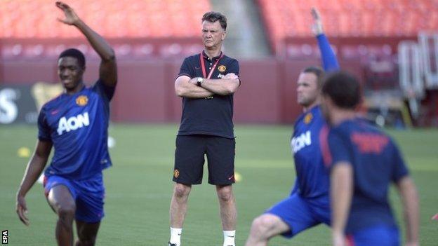 Manchester United head coach Louis van Gaal watches his team training during pre-season training in the United States