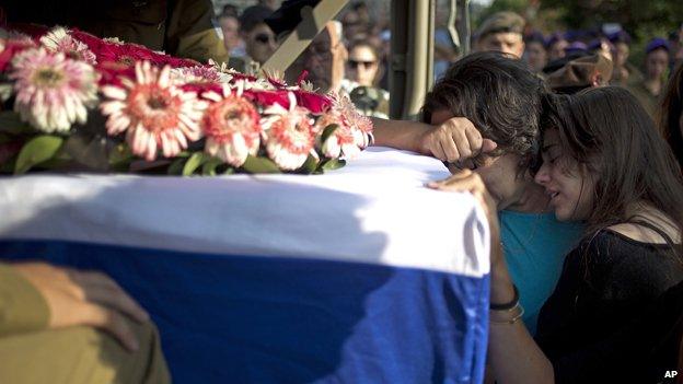 The mother and sister of Sgt Sagi Erez, 19, killed when Hamas fighters attacked from a tunnel, mourn his death