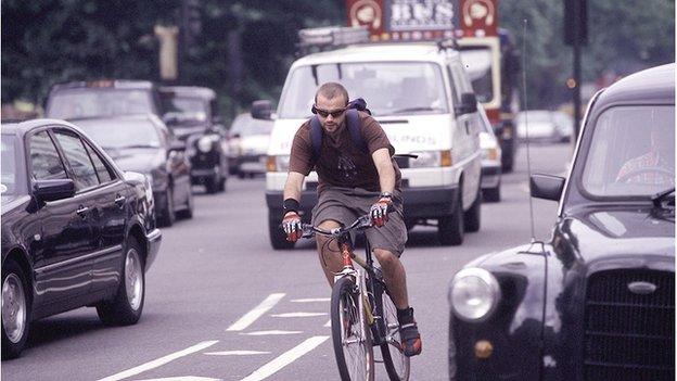 A cyclist in traffic