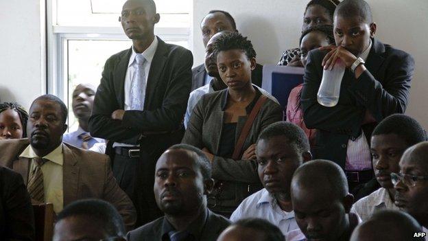 Ugandan human rights activists stand at the Constitutional Court in Kampala , Uganda - 30 July 2014