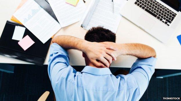 Man holding head in hands