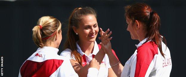 Ellen Falkner, Sophie Tolchard and Sian Gordon celebrate