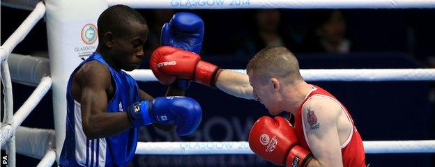 Northern Ireland"s Paddy Barnes (red) in action against Uganda"s Fazil Juma Kaggwa