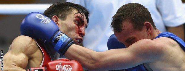 Northern Ireland's Michael Conlan (red) of Northern Ireland competes against Sean McGoldrick of Wales