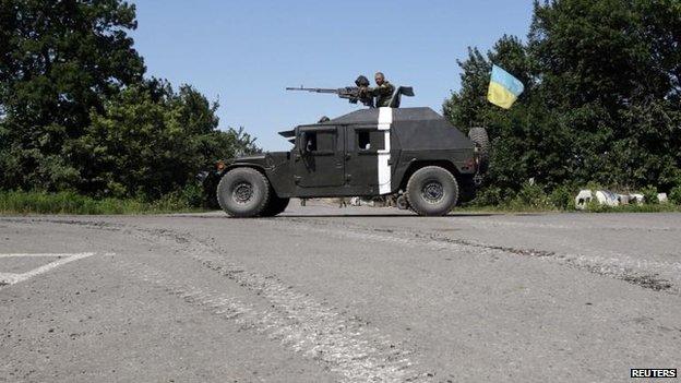 Ukrainian forces outside the eastern Ukrainian village of Nikishyne, Donetsk region, 1 Aug