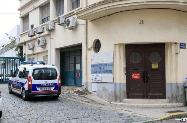 A police car outside a police station in Perpignan, southern France, 2 August