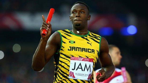 Usain Bolt of Jamaica holds off England's Danny Talbot