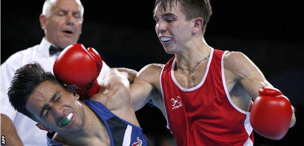 Michael Conlan (right) gets the better of England's Qais Ashfaq