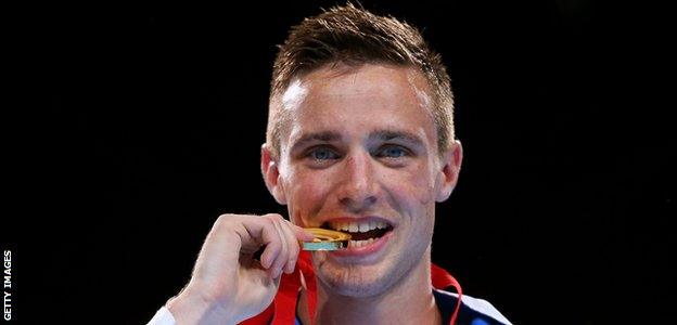 Josh Taylor celebrates winning gold