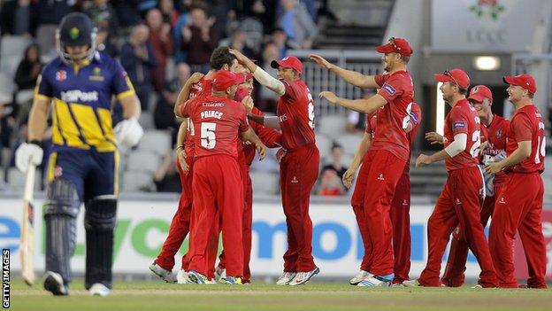 Lancashire celebrate one of Jordan Clark's wickets