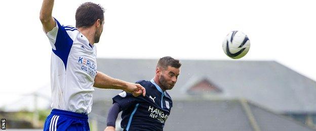 Peter MacDonald scores for Dundee against Peterhead