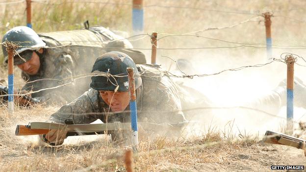 Armenian soldiers from Nagorno-Karabakh crawl through an obstacle course, 25 October 2012