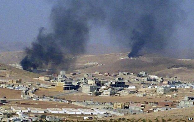 Smoke billows from the Lebanese border town of Arsal, 2 August